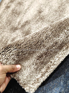 Natural brown runner rug with textured short pile and bound edges