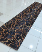 Deep blue runner rug with gold and light-blue ornate vine swirl design, full length