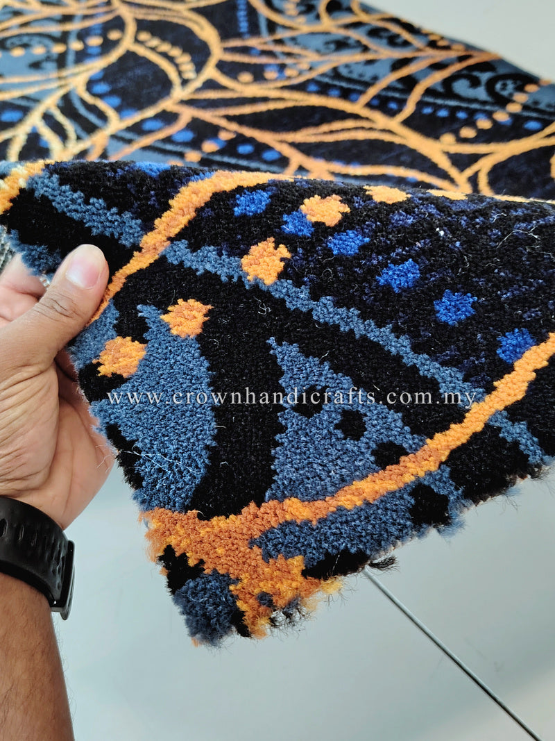 Dark blue runner carpet with gold and light-blue vine swirl pattern, textured pile close-up