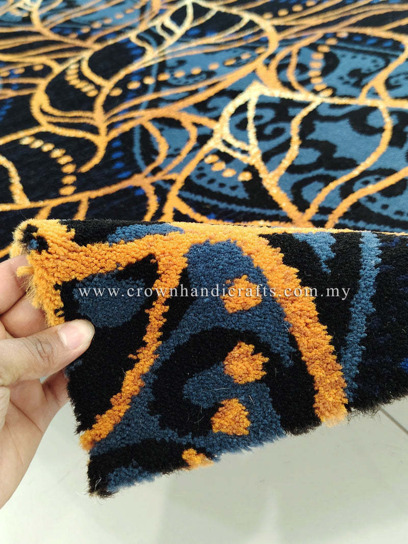 Deep blue runner carpet with gold and light-blue ornate swirl pattern, close-up edge