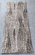 Abstract hallway runner rug, full view with vertical stripe texture in gray and ivory
