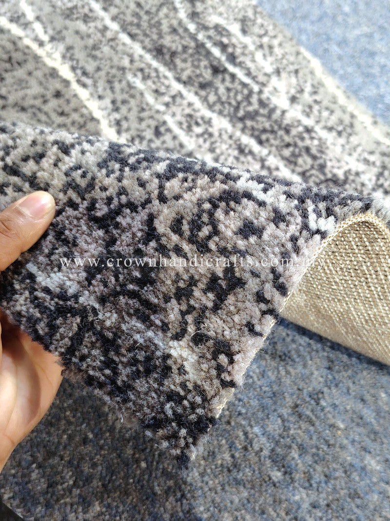 Abstract runner rug corner close-up, textured pile with gray and white abstract pattern