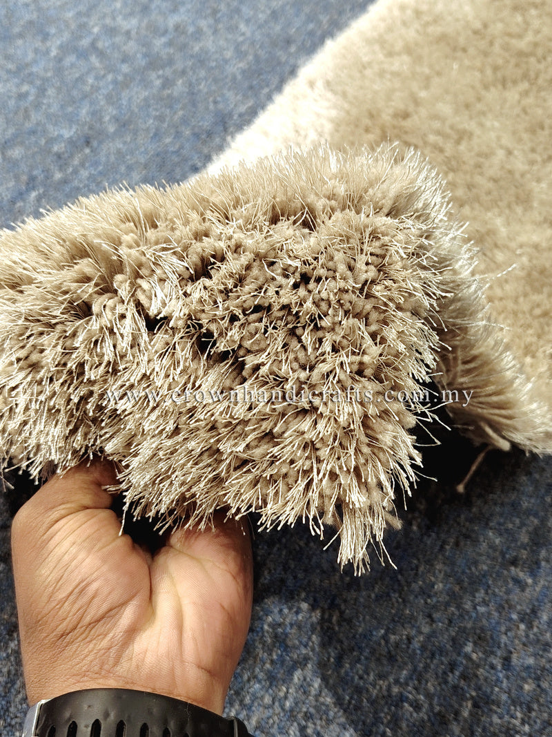 Beige shag runner rug close-up, lifted high-pile fibers texture