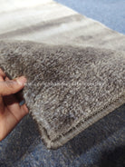 Hallway runner rug close-up of thick textured pile and folded corner edge