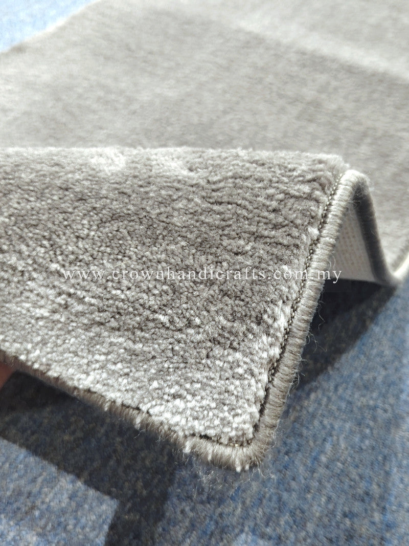 Hallway runner rug corner close-up with tightly bound fringe and dense short pile
