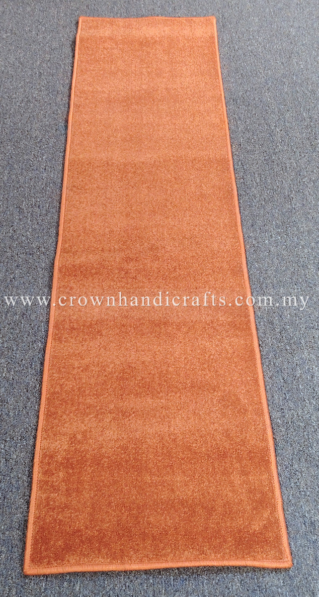 Rust velvet runner rug, full length view with straight edges and plush texture