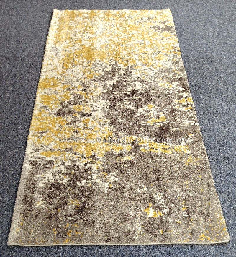 Two-tone runner rug with grey and yellow abstract distressed pattern, wide top view