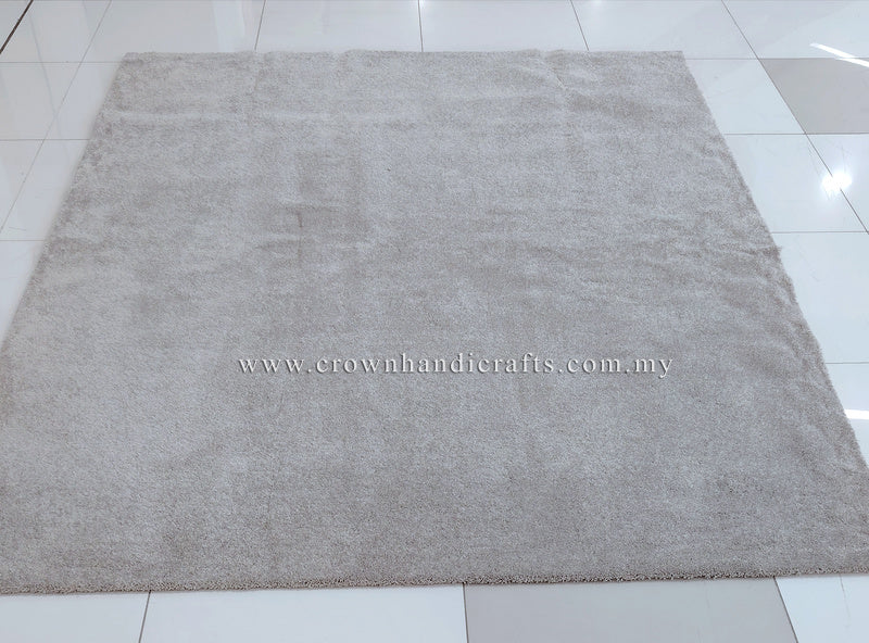 Plush area rug with even short pile texture in light gray-beige, centered view