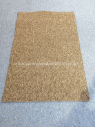 Rectangular brown door mat rug, evenly textured surface with flat edges