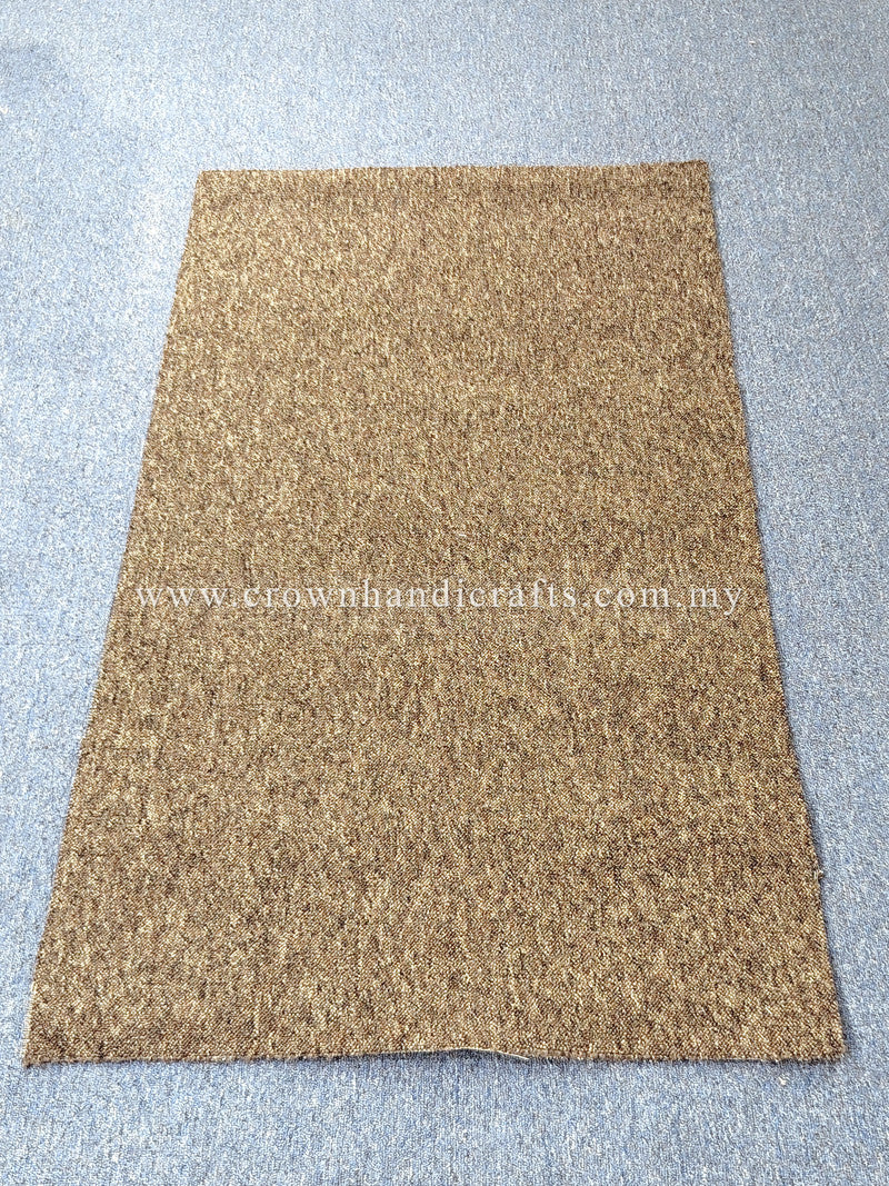 Tan-brown rectangular rug with low pile texture and simple flat border