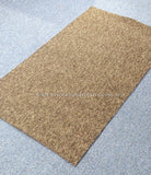 Rectangular brown-tan rug, flat weave texture with stitched edges, no pattern