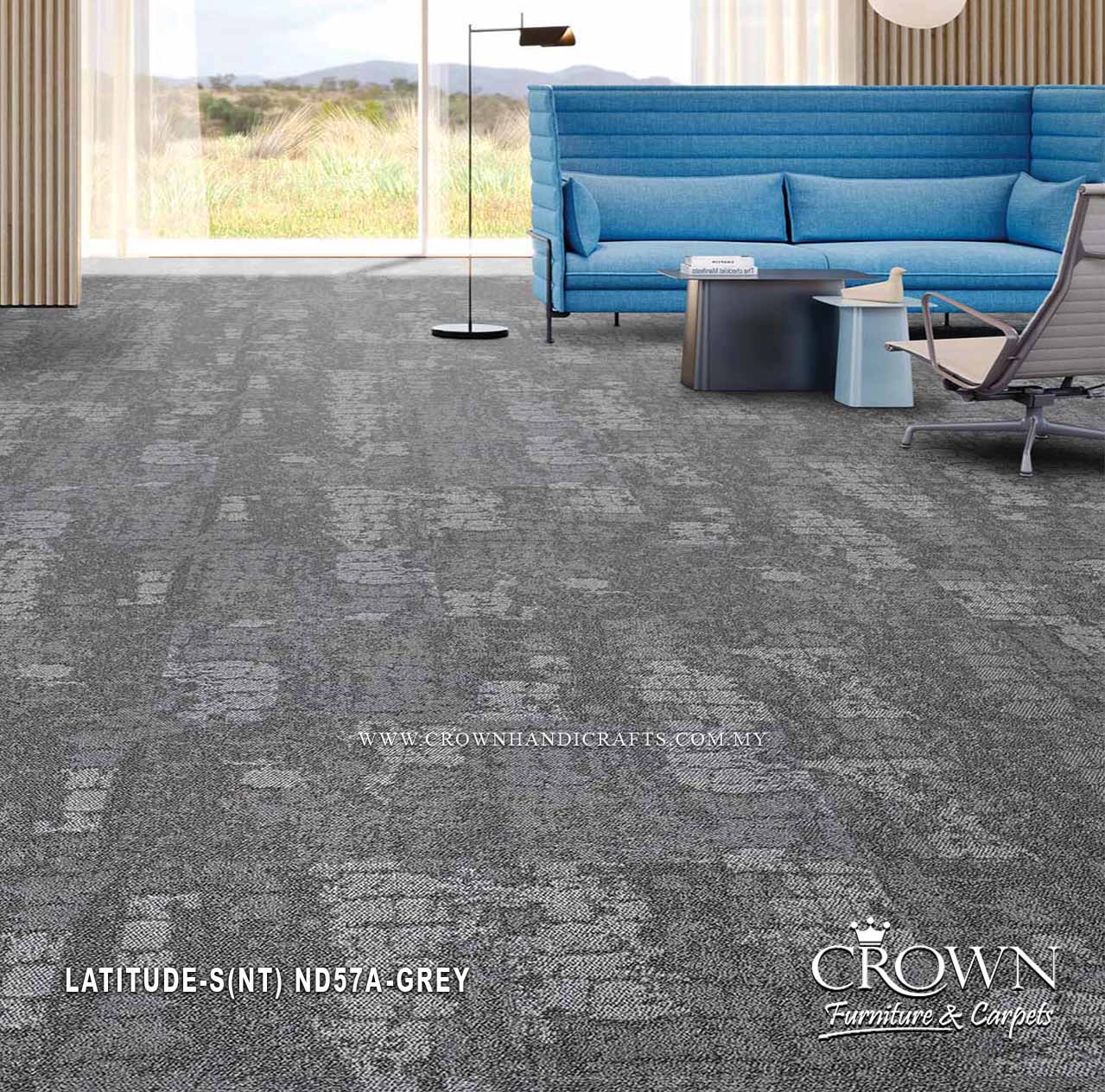 Grey patterned carpet tiles laid across a modern room floor with contemporary seating