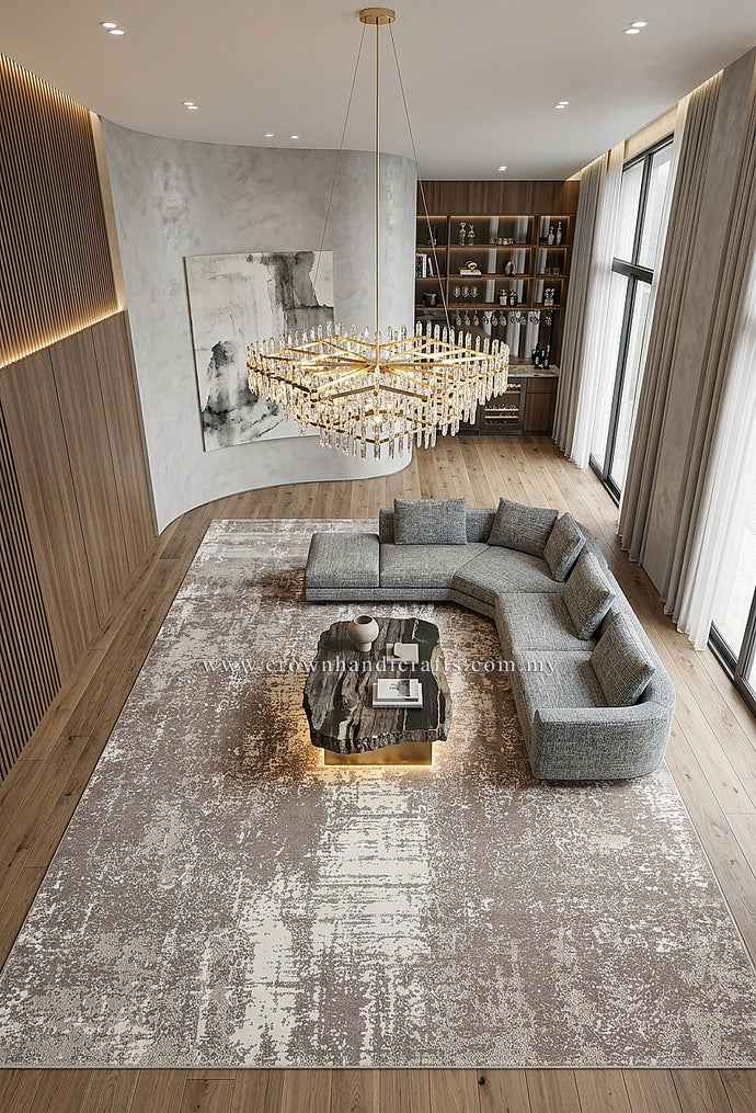 Large abstract area rug with worn beige and white motif, stitched border.