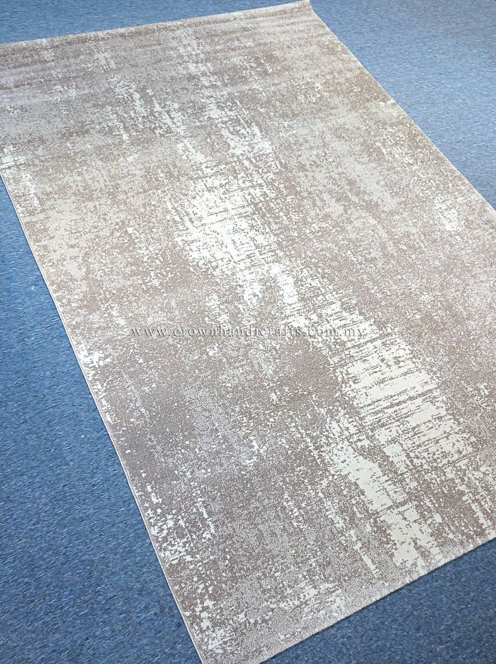Abstract area rug with worn beige and white abstract strokes, diagonal view.