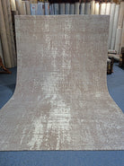 Light grey abstract area rug with distressed texture, rectangular