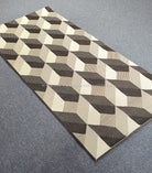 Rectangular runner rug with repeating cube squares in cream and dark brown