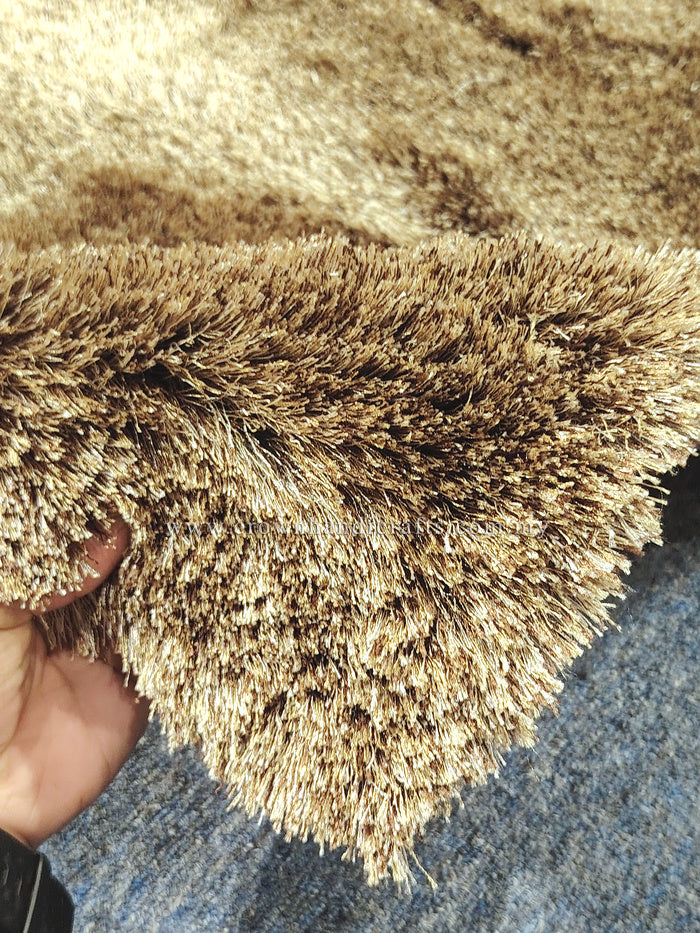 Shaggy brown multi-tone runner rug with high pile, close-up texture detail