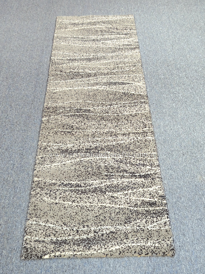 Beige abstract runner carpet with horizontal stripe bands and dark speckled weave, full view.