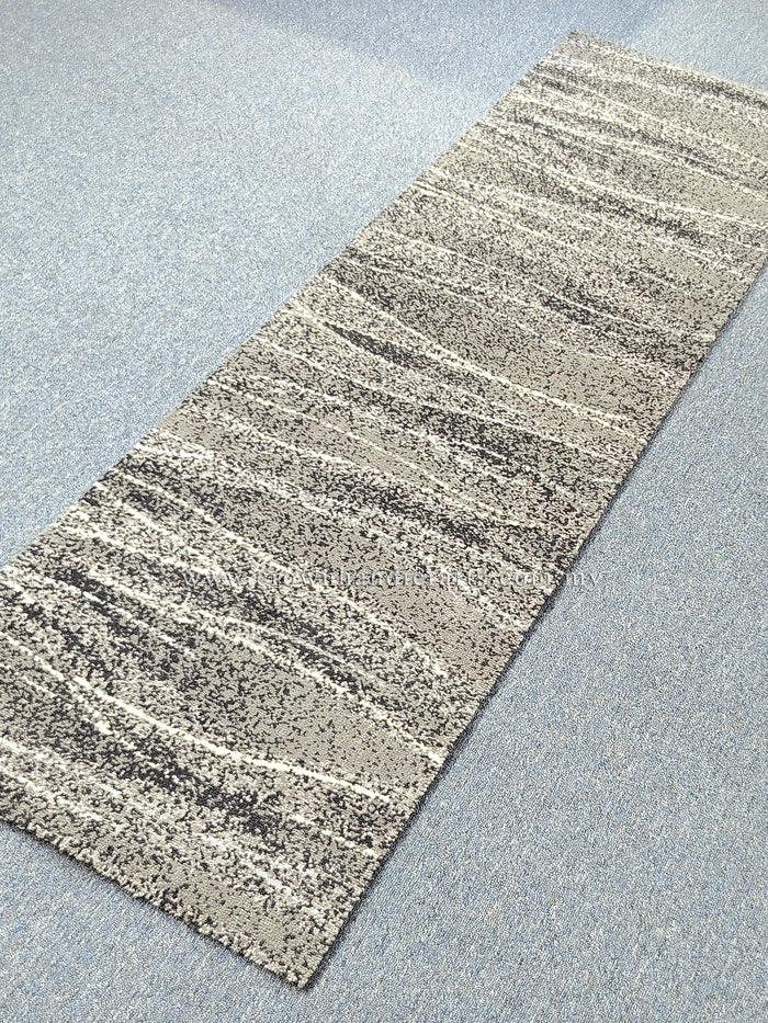 Abstract runner carpet with beige horizontal stripe bands and dark speckled texture.