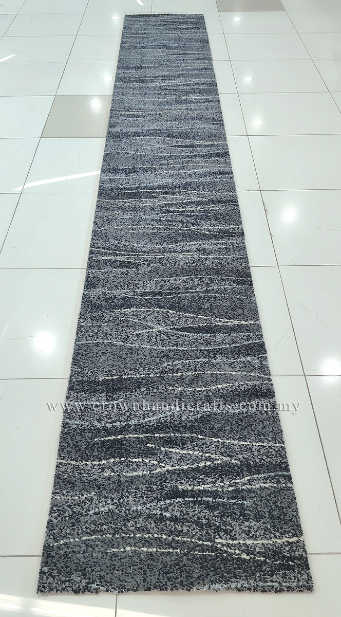 Long abstract runner rug laid flat, dark blue-gray abstract stripes and speckled highlights