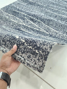 Abstract runner rug, dark blue-gray with light speckled dots and striped pattern