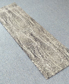 Abstract narrow runner rug with light beige and gray distressed stripe motif