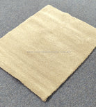 Beige rectangular plush comfort mat with even, soft shag pile surface