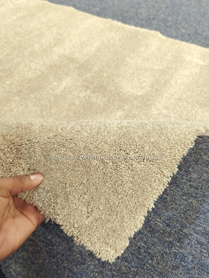 Plush beige comfort mat showing dense shag texture along lifted corner