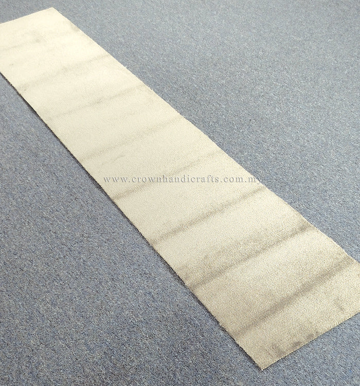 Cream-beige runner rug laid flat with minimal texture and straight stitched edges
