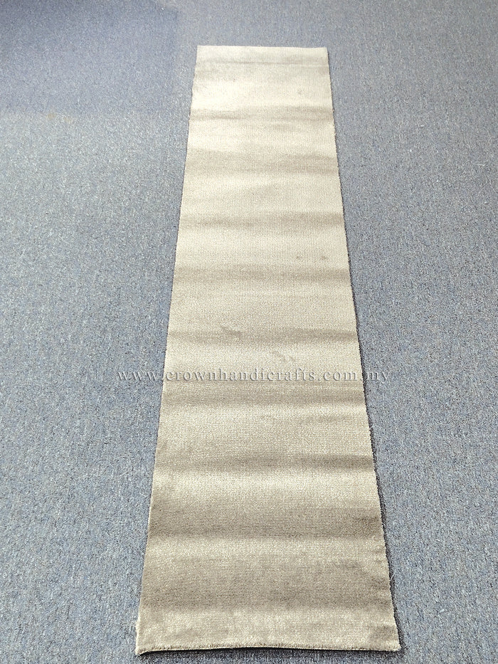 Beige runner rug laid flat with horizontal tonal stripe bands and low pile texture