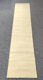 Beige runner rug, narrow rectangle, flat woven with even pile