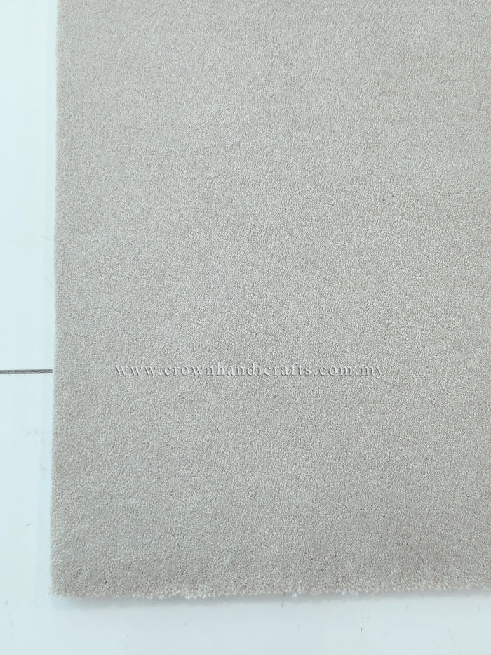 Oatmeal-beige area rug with soft shag pile and clean border
