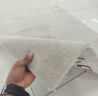 Oatmeal beige runner rug corner, soft shag pile with folded edge