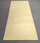 Cream hallway runner rug straight-on view, even pile and neat border hem