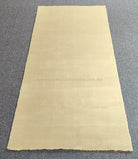 Oatmeal-beige runner rug with straight edges and plush, short pile texture