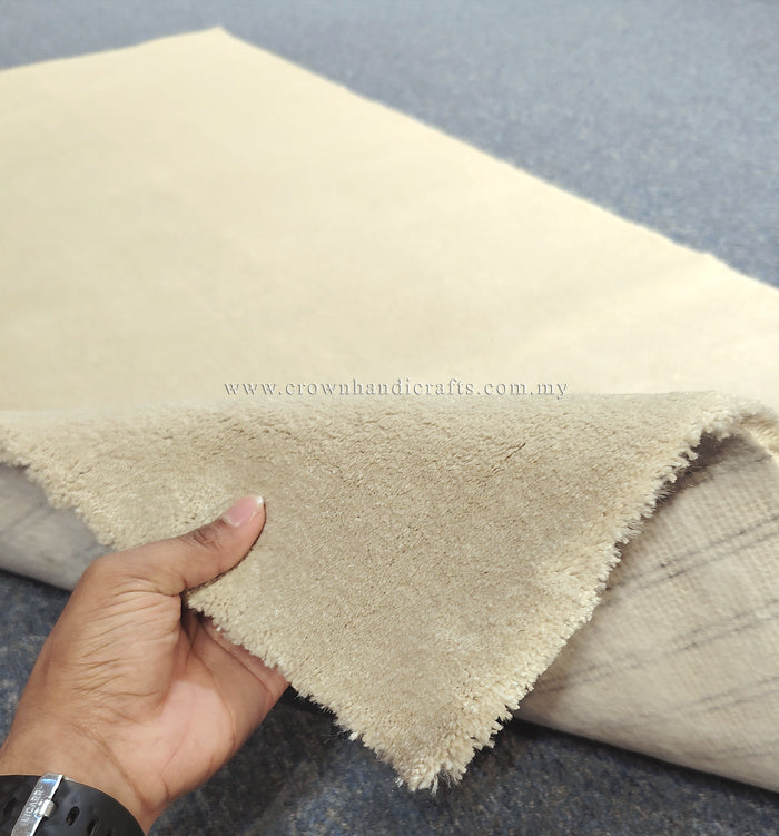 Oatmeal-beige runner rug showing soft cut-pile texture and folded edge