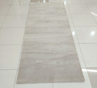 Oatmeal beige runner area rug with even low pile and simple rectangular outline