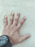 Oatmeal beige soft area rug with plush pile texture and tight surface detail