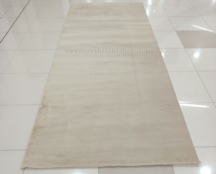 Cream area rug with smooth low pile and even color tone