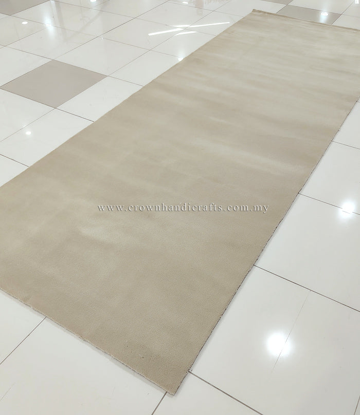 Large cream area rug flat-lay on tile with low, even pile