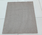 Soft brown square shag rug with even plush pile, top view