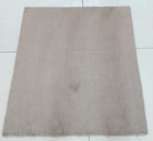 Soft brown square shag rug with uniform plush texture, top view