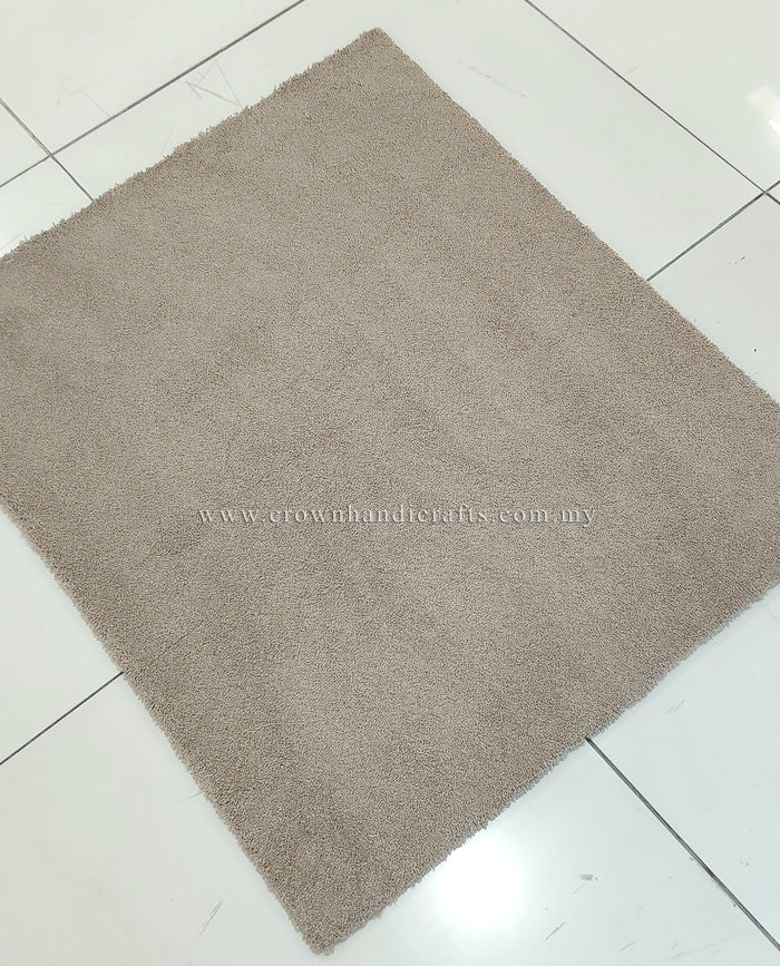 Soft brown shag rug with short plush pile, straight-on square view