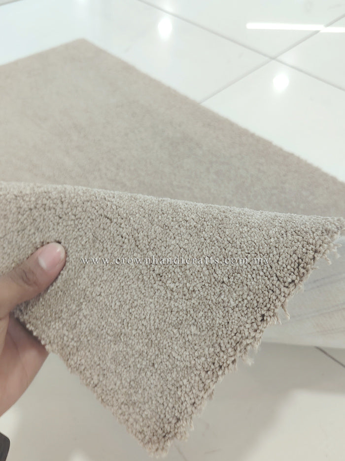 Soft brown fluffy shag rug corner with dense shag pile texture, shown close-up