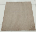 Soft shaggy accent rug with dense short pile, taupe brown square, flat top view