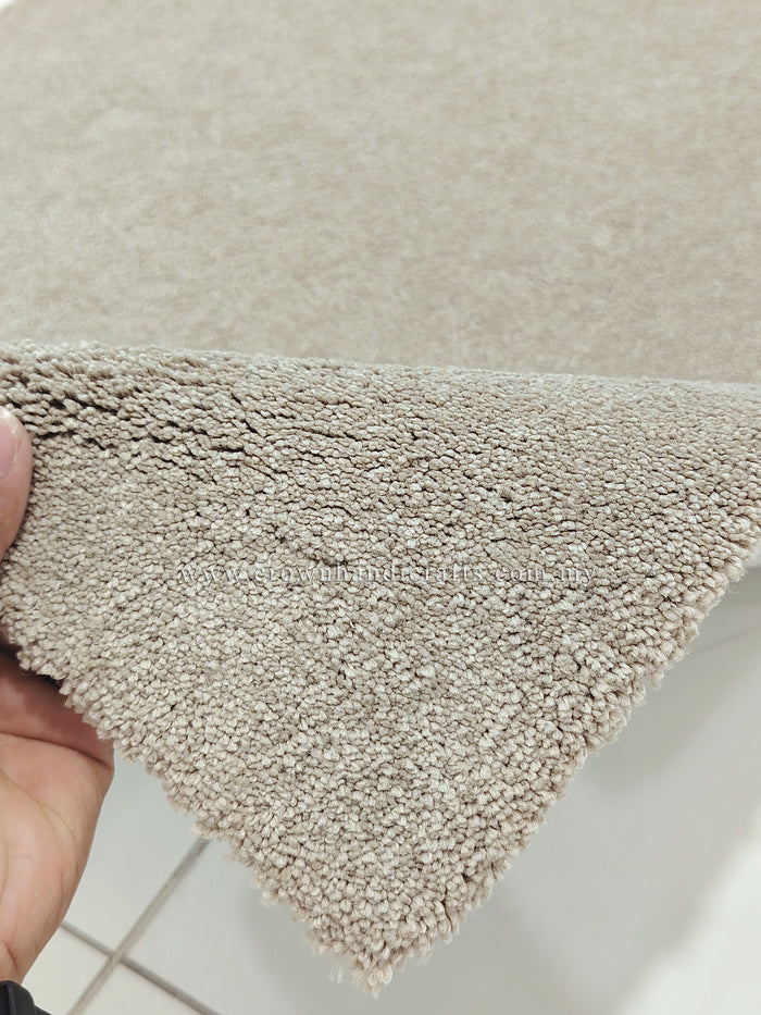 Shaggy accent rug with short plush loop pile, light beige and neatly bound corner