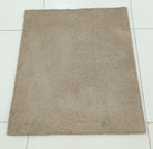 Rectangular shaggy rug, light brown, full flat view with short dense pile.