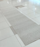 Natural runner rug angled view, ivory and taupe textured weave runner