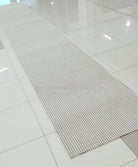 Natural runner rug with tight loop texture and thin border, long rectangular