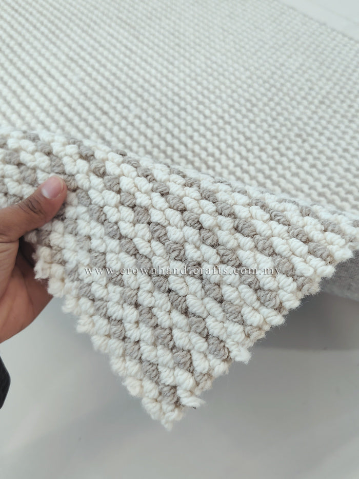 Natural runner rug close-up, ivory and taupe striped loops with fringed trim